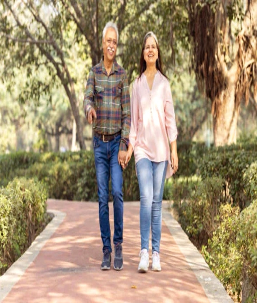 A couple walking in a park